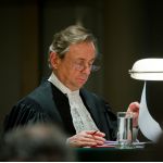 The Registrar of the ICJ, H. E. Mr Philippe Couvreur, at the opening of the ICJ hearings in the case concerning the Maritime Dispute (Peru v. Chile). This session took place, exceptionally, in the auditorium of The Hague Academy of International Law. The ICJ's role is to settle, in accordance with international law, legal disputes submitted to it by States (its Judgments are final and binding) and to give advisory opinions on legal questions referred to it by authorized UN organs and agencies.
