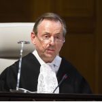 The Registrar of the Court, H.E. Mr Philippe Couvreur, during the delivery of the Judgment in the case concerning the Obligation to Negotiate Access to the Pacific Ocean (Bolivia v. Chile) (jurisdiction phase), on Thursday 24 September 2015, at the Peace Palace in The Hague, the seat of the Court. The Judgment solely dealt with the preliminary objection to jurisdiction raised by Chile.