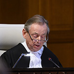 Le greffier de la Cour, S. Exc. M. Philippe Couvreur, le 13 février 2019 (lecture de l’arrêt de la Cour)