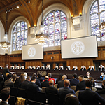 The Members of the Court on the opening day of the hearings. 
